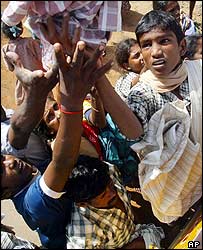 Residents scramble for clothes in Nagappattinam, in the southern Indian state of Tamil Nadu